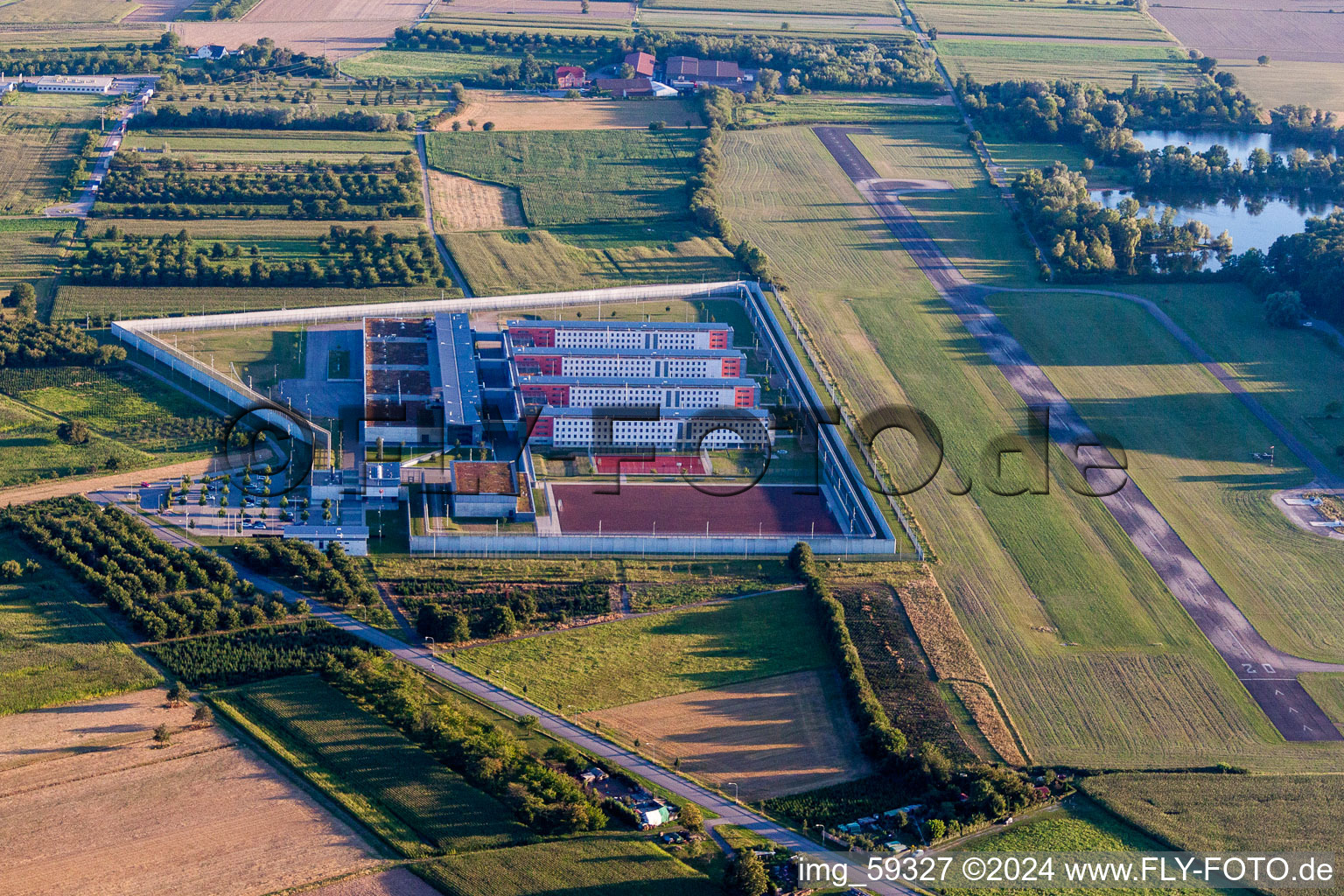 Aerial view of Prison grounds and high security fence Prison Justizvollzugsanstalt Offenburg on Flugplatz Offenburg-Baden in Offenburg in the state Baden-Wurttemberg, Germany