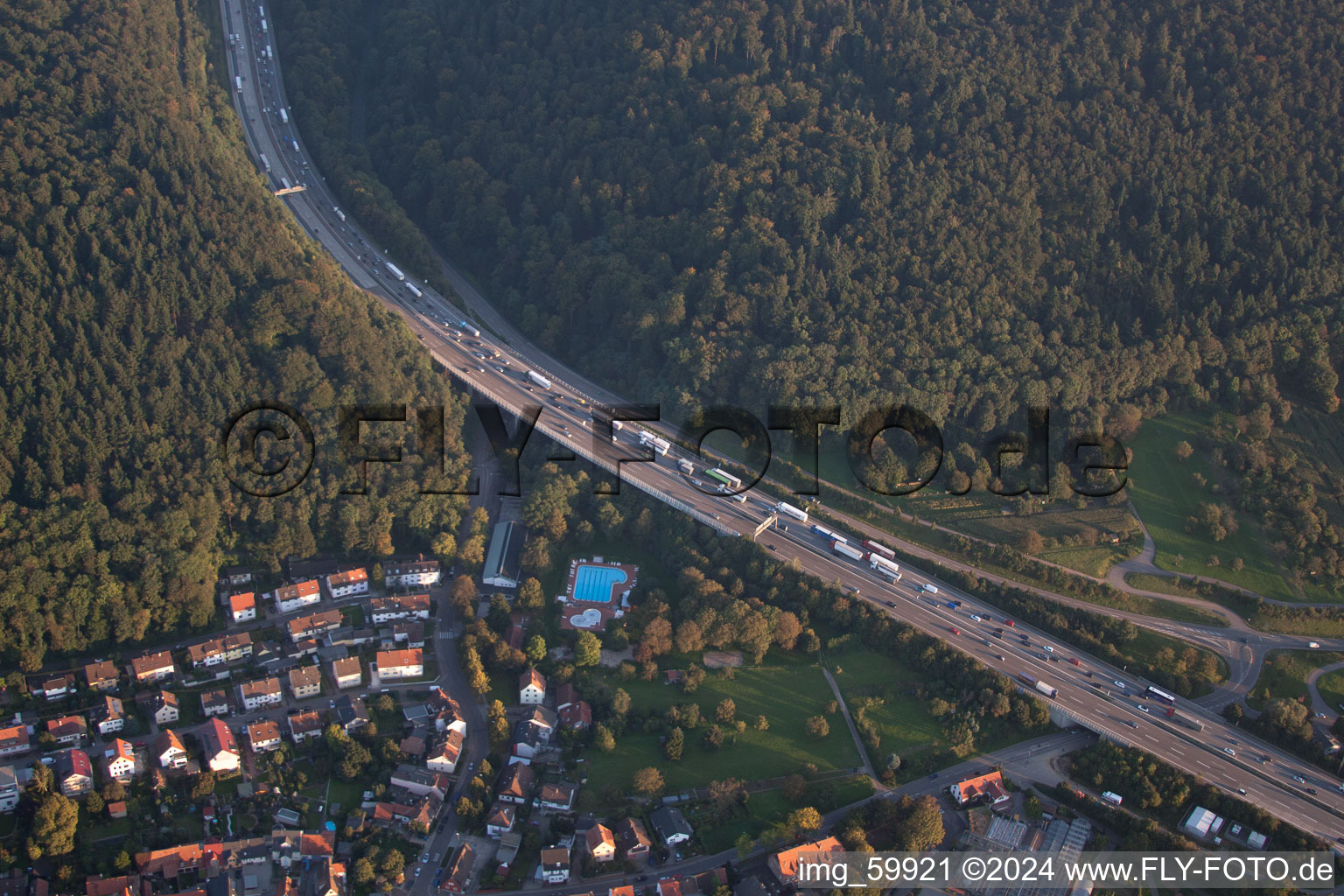 Aerial view of Wölfle outdoor pool under the A6 motorway in the district Wolfartsweier in Karlsruhe in the state Baden-Wuerttemberg, Germany