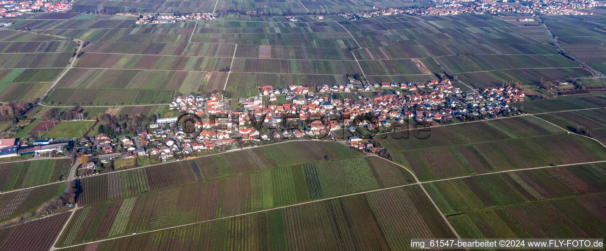 Aerial view of Village - view on the edge of agricultural fields and farmland in Roschbach in the state Rhineland-Palatinate, Germany