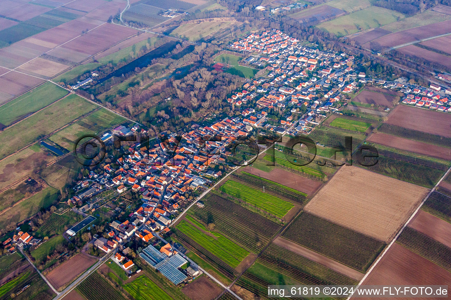 Oblique view of Village - view on the edge of agricultural fields and farmland in Winden in the state Rhineland-Palatinate, Germany