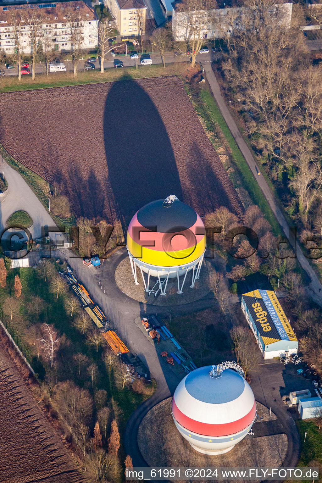 French German painted gas storage tanks in Rastatt in the state Baden-Wuerttemberg, Germany out of the air