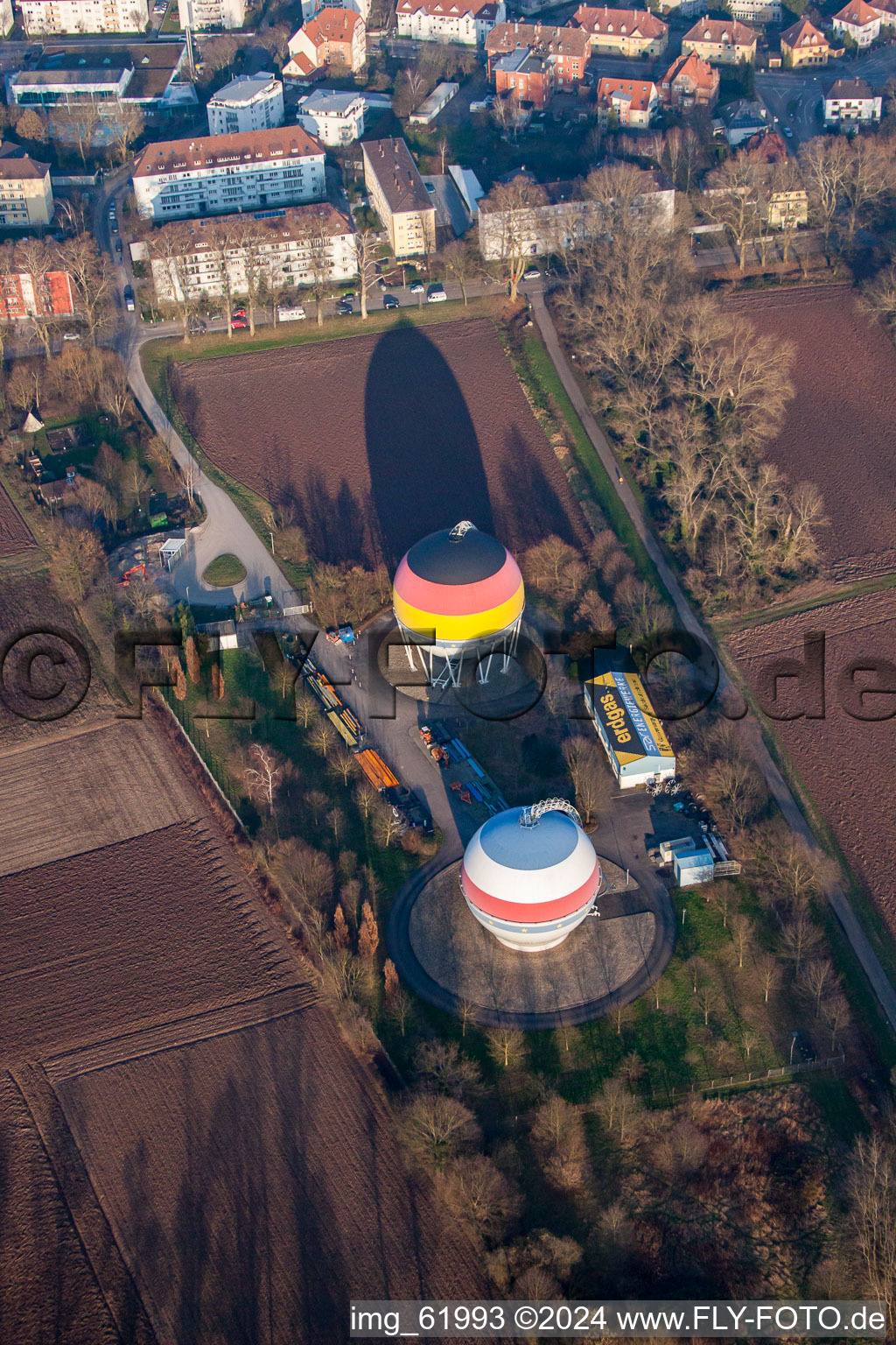 French German painted gas storage tanks in Rastatt in the state Baden-Wuerttemberg, Germany from the plane