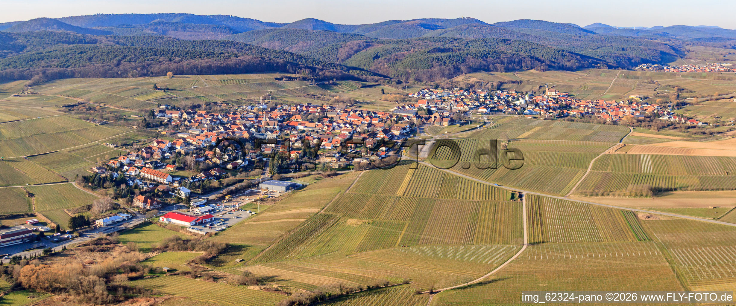 Village panorama from the southwest with the start of the German Wine Route in the district Schweigen in Schweigen-Rechtenbach in the state Rhineland-Palatinate, Germany