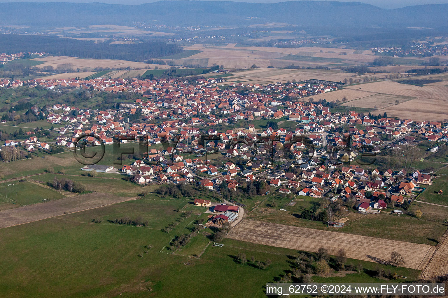 Aerial photograpy of Village - view on the edge of agricultural fields and farmland in Surbourg in Grand Est, France