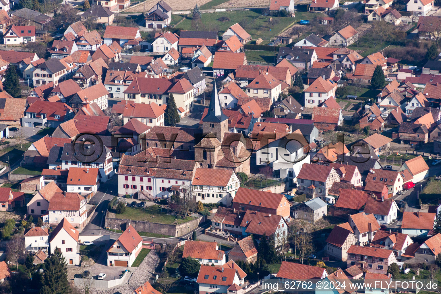 Aerial view of Church building in of PresbytA?re Catholique Old Town- center of downtown in Surbourg in Grand Est, France