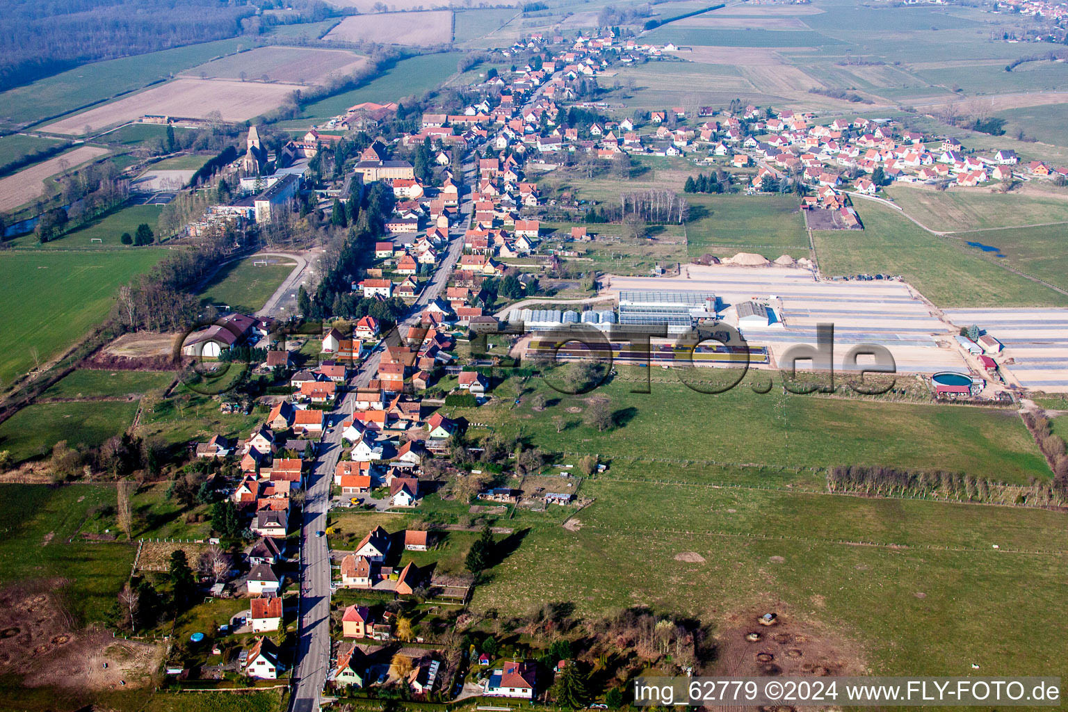 Village - view on the edge of agricultural fields and farmland in Walbourg in Grand Est, France