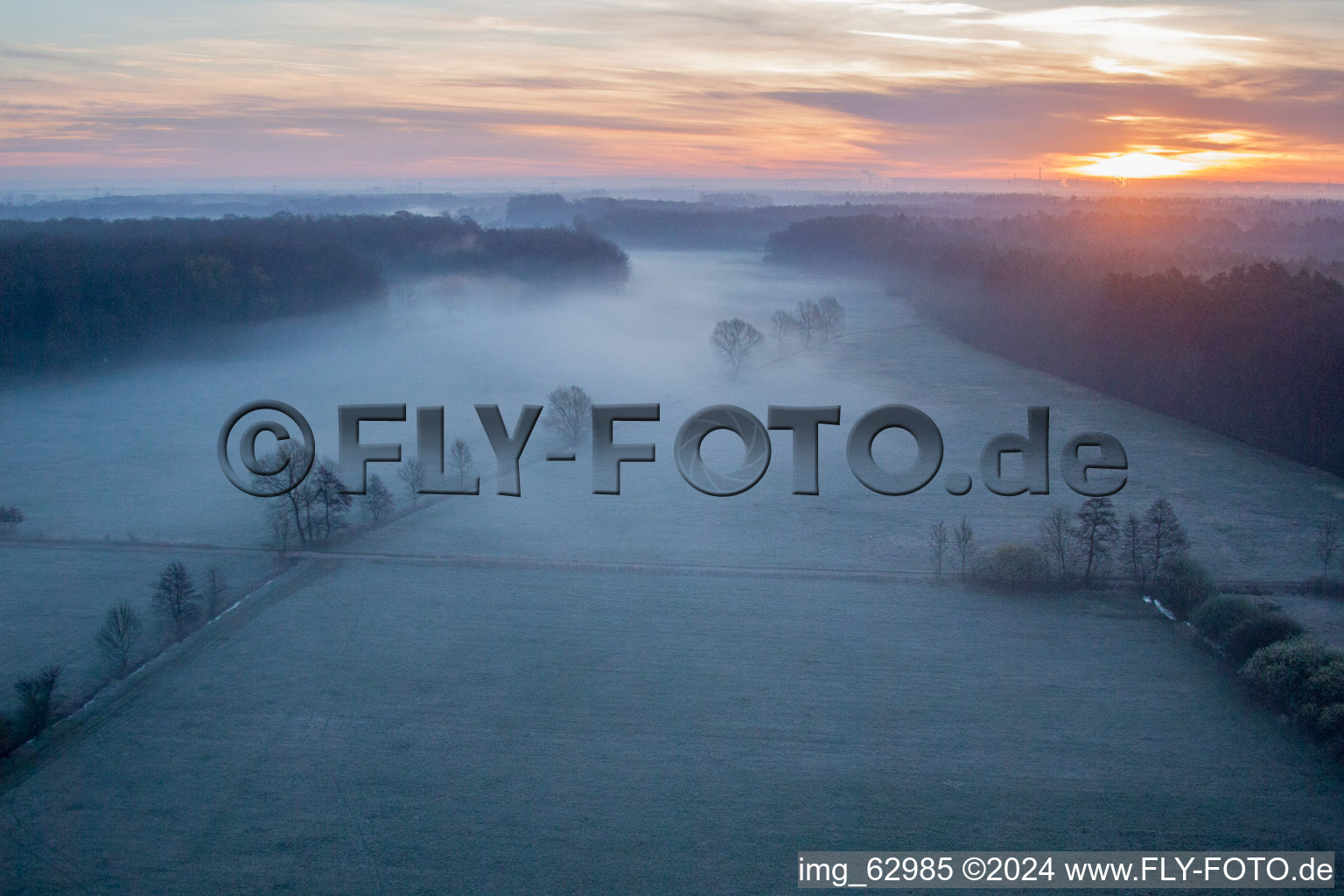 Sunrise haze at structures of a field landscape Otterbachtal in Minfeld in the state Rhineland-Palatinate