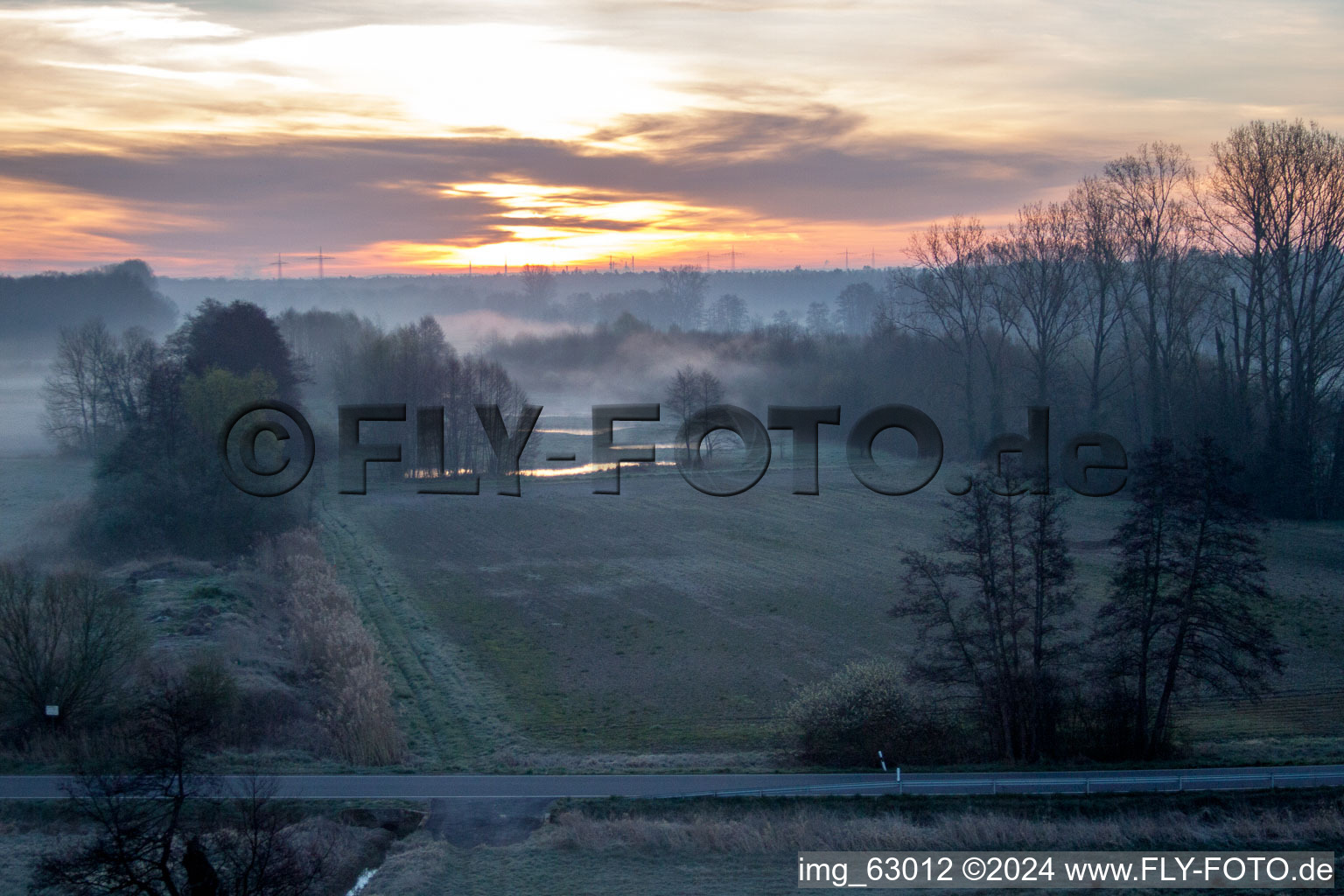 Aerial view of Sunrise haze at structures of a field landscape Otterbachtal in Minfeld in the state Rhineland-Palatinate