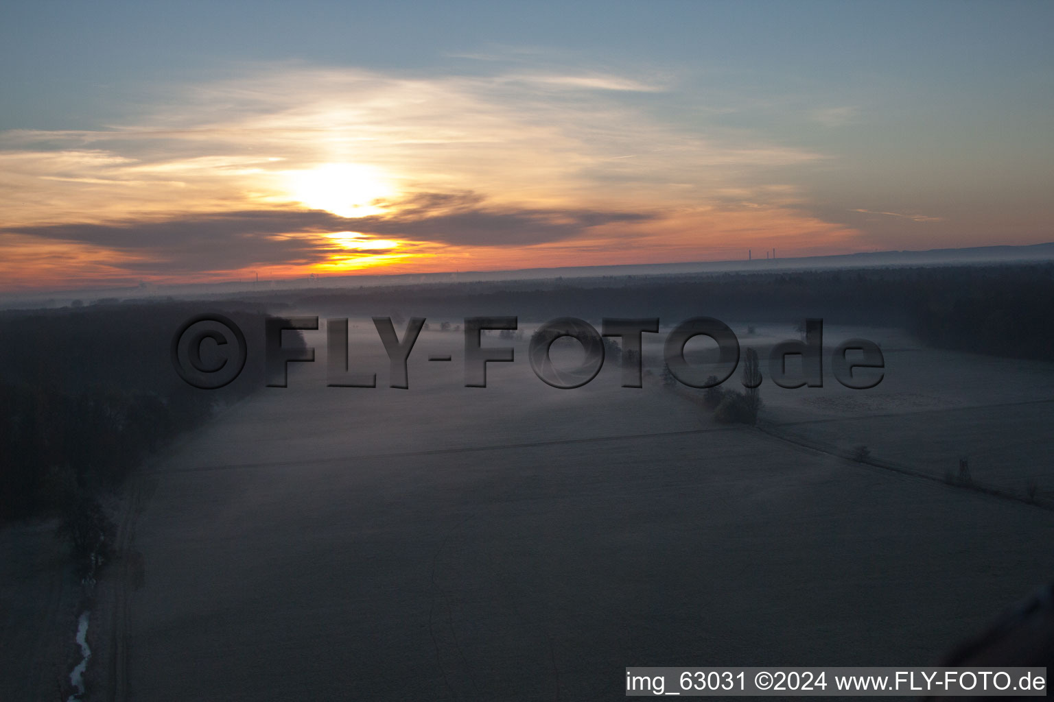 Aerial photograpy of Sunrise haze at structures of a field landscape Otterbachtal in Minfeld in the state Rhineland-Palatinate