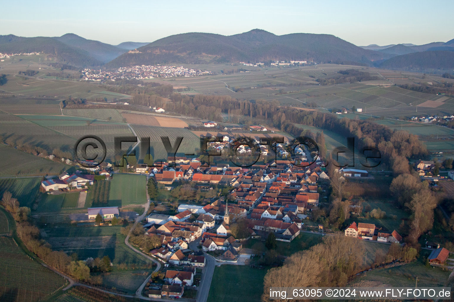 Village - view on the edge of agricultural fields and wine yards in the district Klingen in Heuchelheim-Klingen in the state Rhineland-Palatinate, Germany