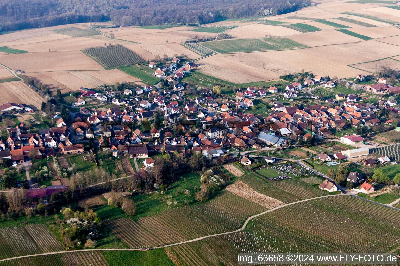 Aerial photograpy of Village - view on the edge of agricultural fields and farmland in Steinseltz in Grand Est, France