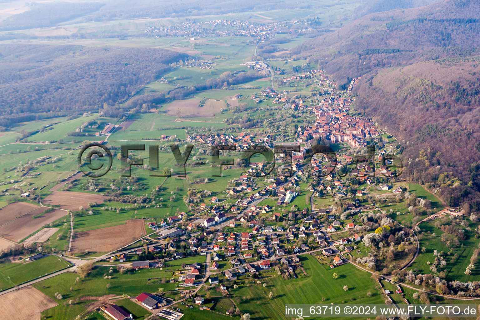 Village - view on the edge of agricultural fields and farmland in Oberbronn in Grand Est, France