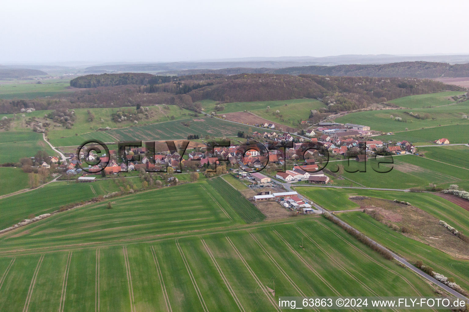 Village - view on the edge of agricultural fields and farmland in the district Linden in Straufhain in the state Thuringia, Germany