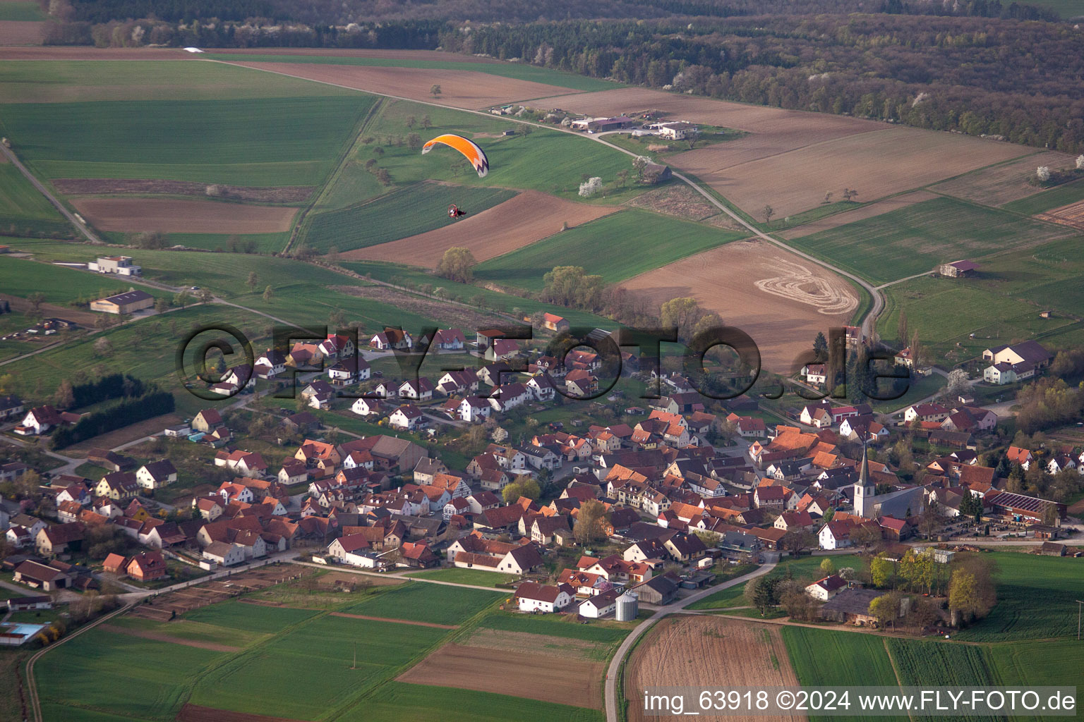 Village - view on the edge of agricultural fields and farmland in Wargolshausen in the state Bavaria, Germany