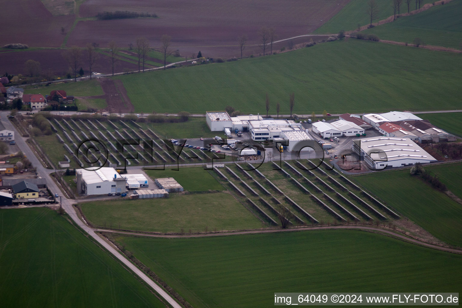 Aerial view of Village - view on the edge of agricultural fields and farmland in Straufhain in the state Thuringia, Germany