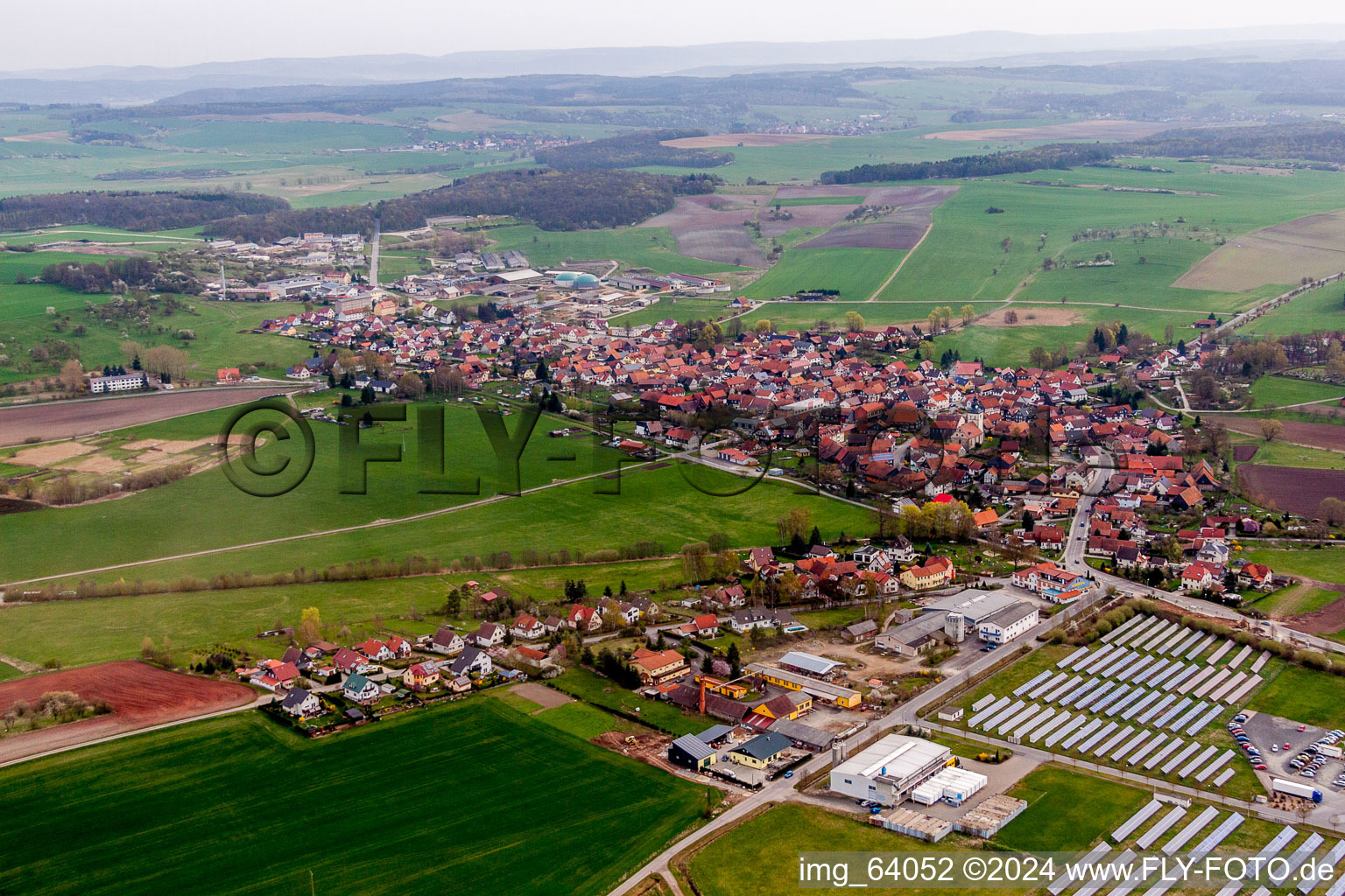 Village - view on the edge of agricultural fields and farmland in Straufhain in the state Thuringia, Germany