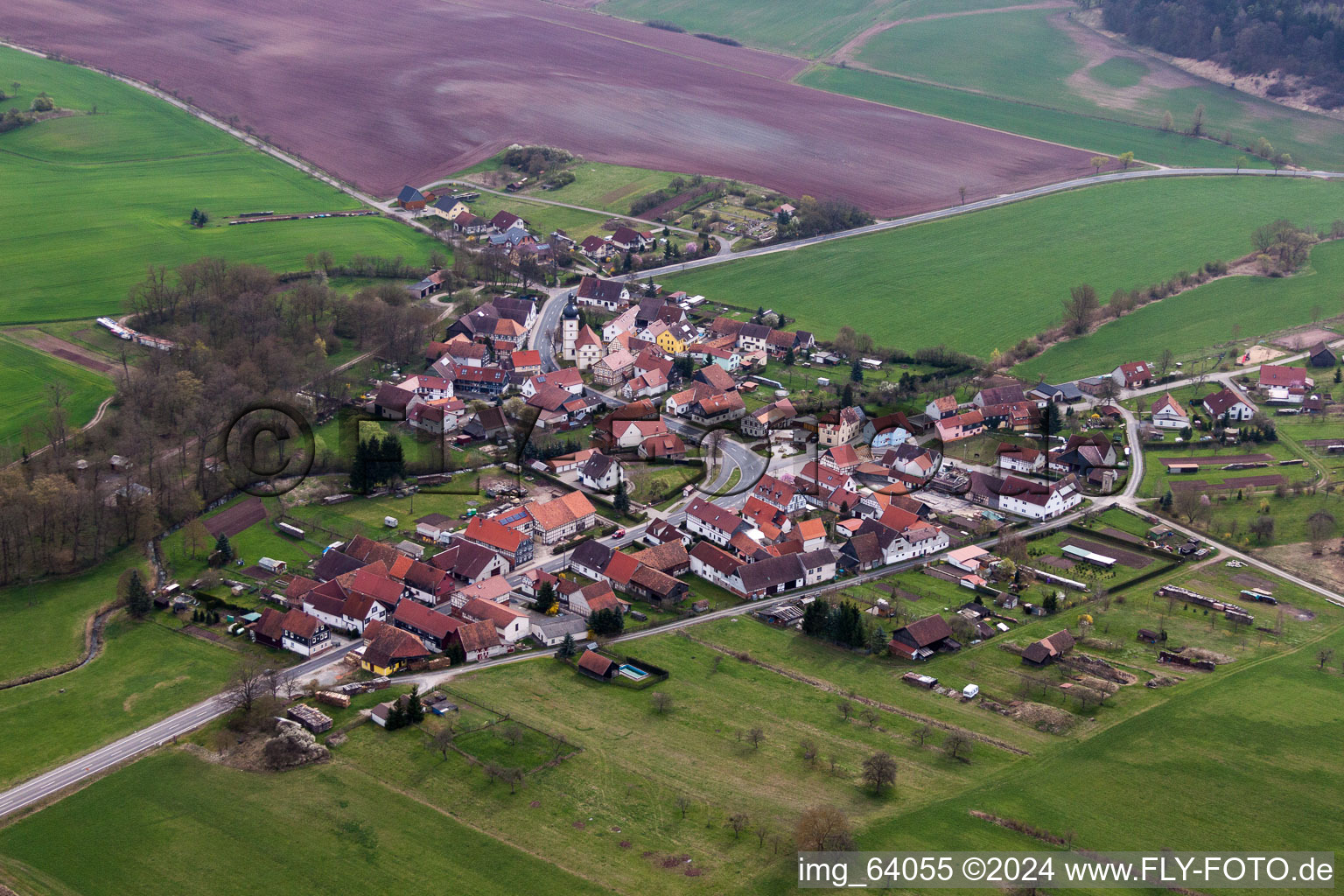 Village - view on the edge of agricultural fields and farmland in Seidingstadt in the state Thuringia, Germany