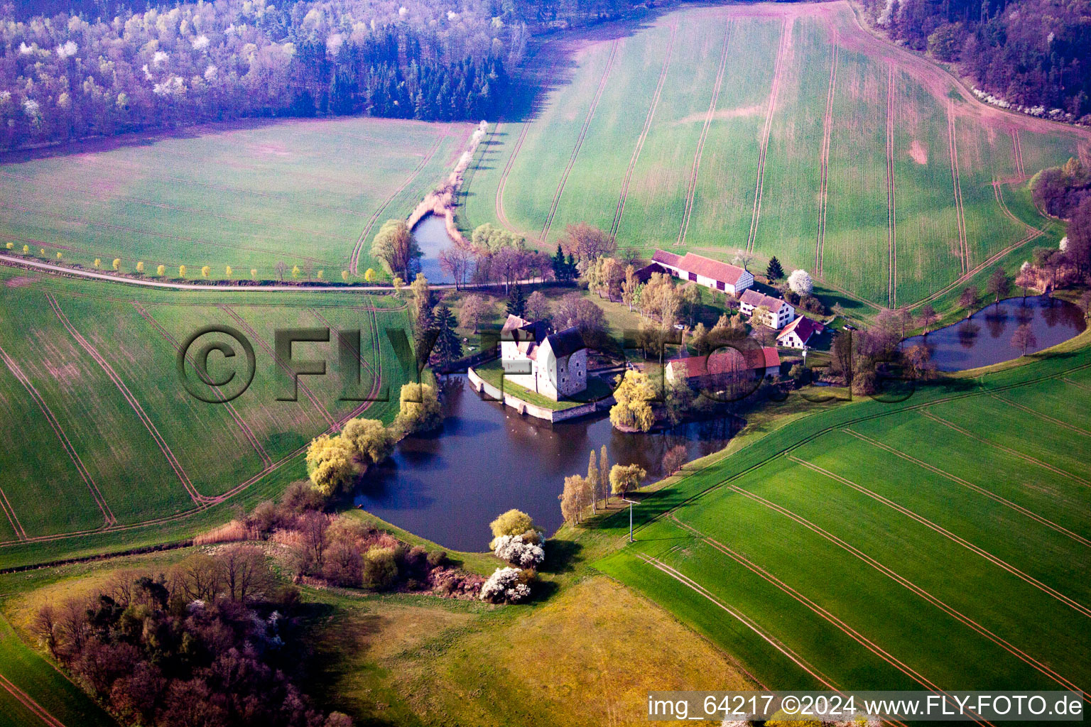 Aerial view of Building and castle park systems of water castle Brennhausen in the district Brennhausen in Sulzdorf an der Lederhecke in the state Bavaria, Germany