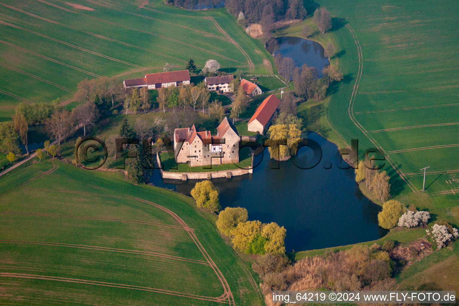 Oblique view of Building and castle park systems of water castle Brennhausen in the district Brennhausen in Sulzdorf an der Lederhecke in the state Bavaria, Germany