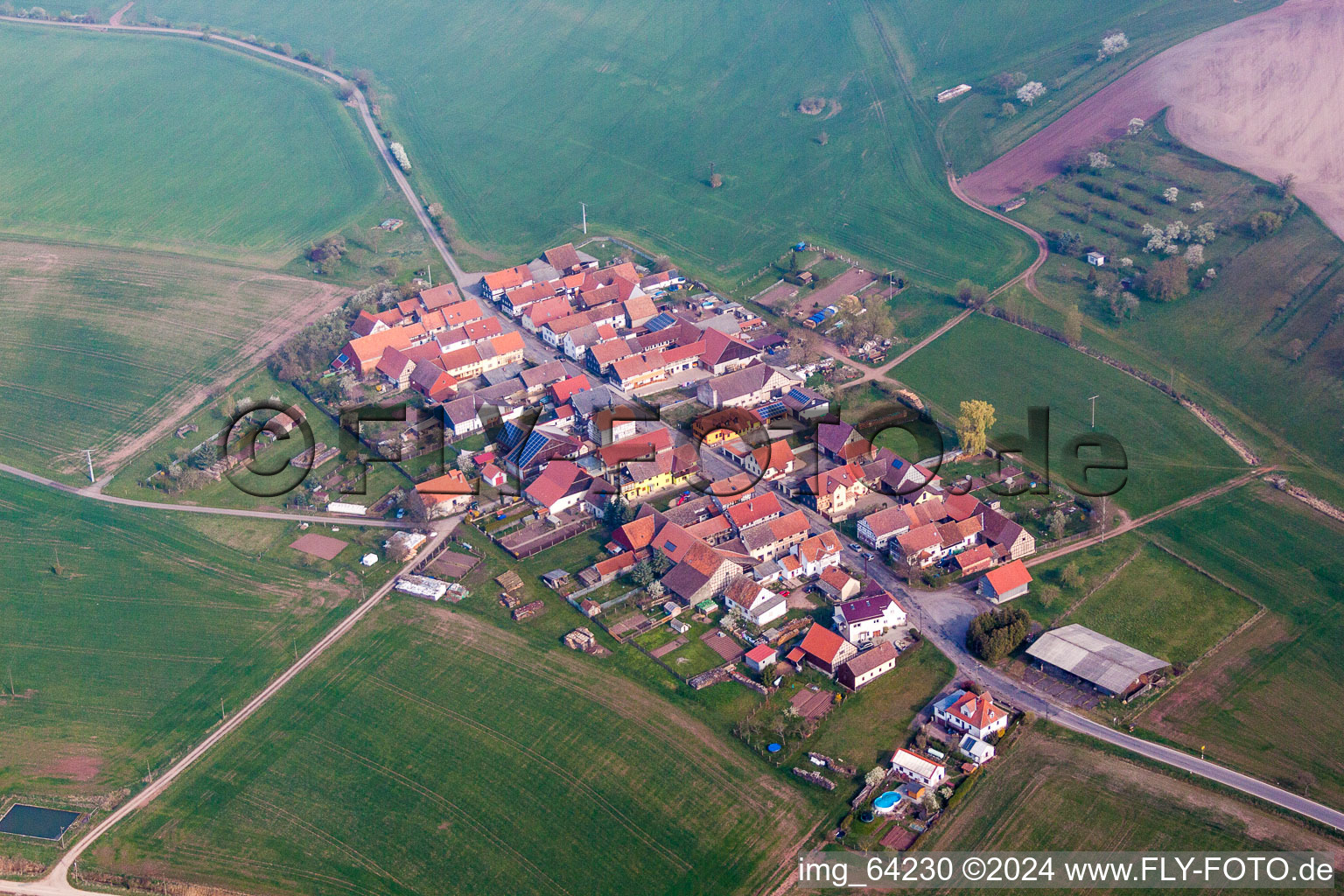 Village - view on the edge of agricultural fields and farmland in the district Albingshausen in Hellingen in the state Thuringia, Germany