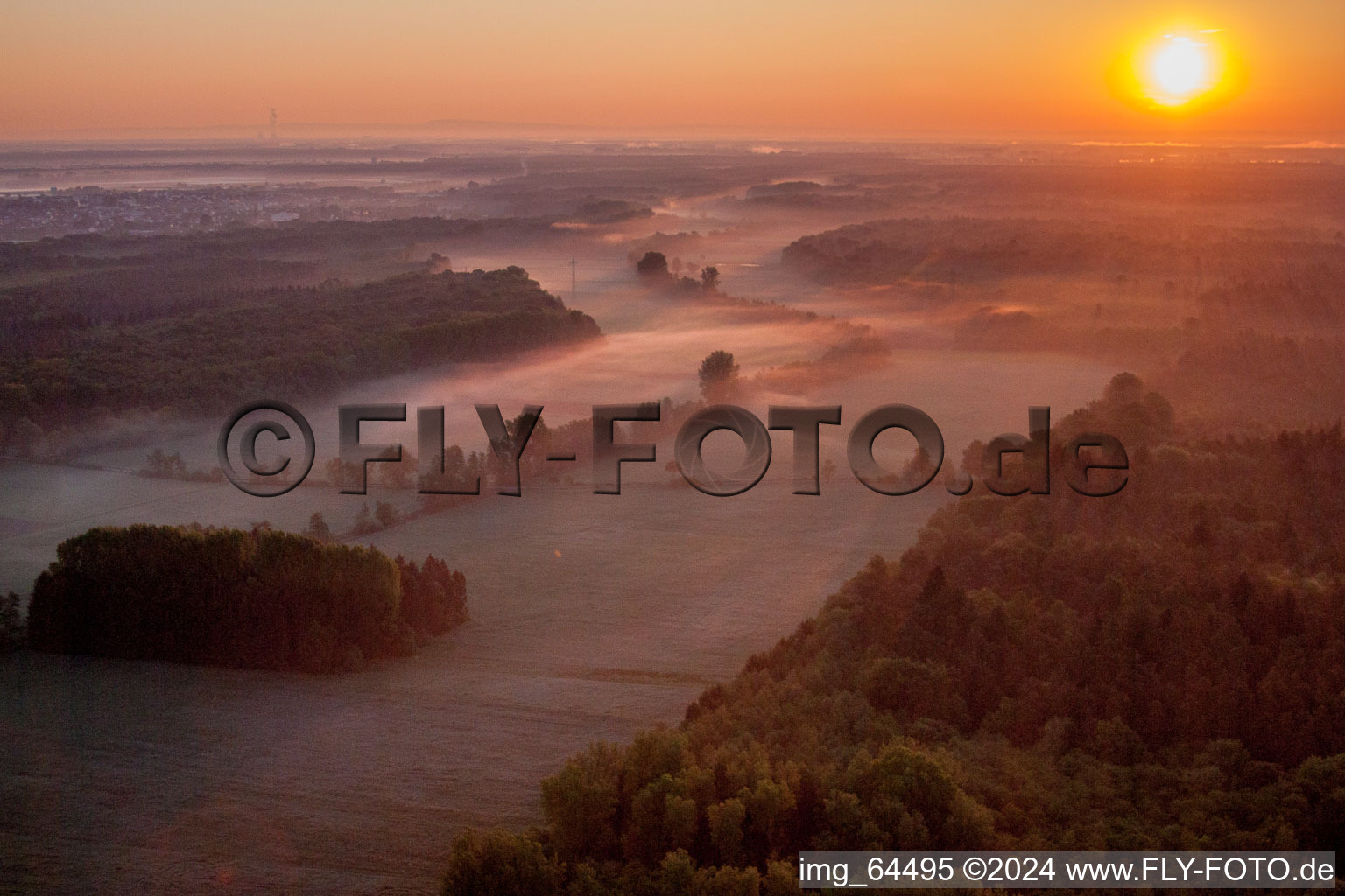 Oblique view of Sunrise haze at structures of a field landscape Otterbachtal in Minfeld in the state Rhineland-Palatinate