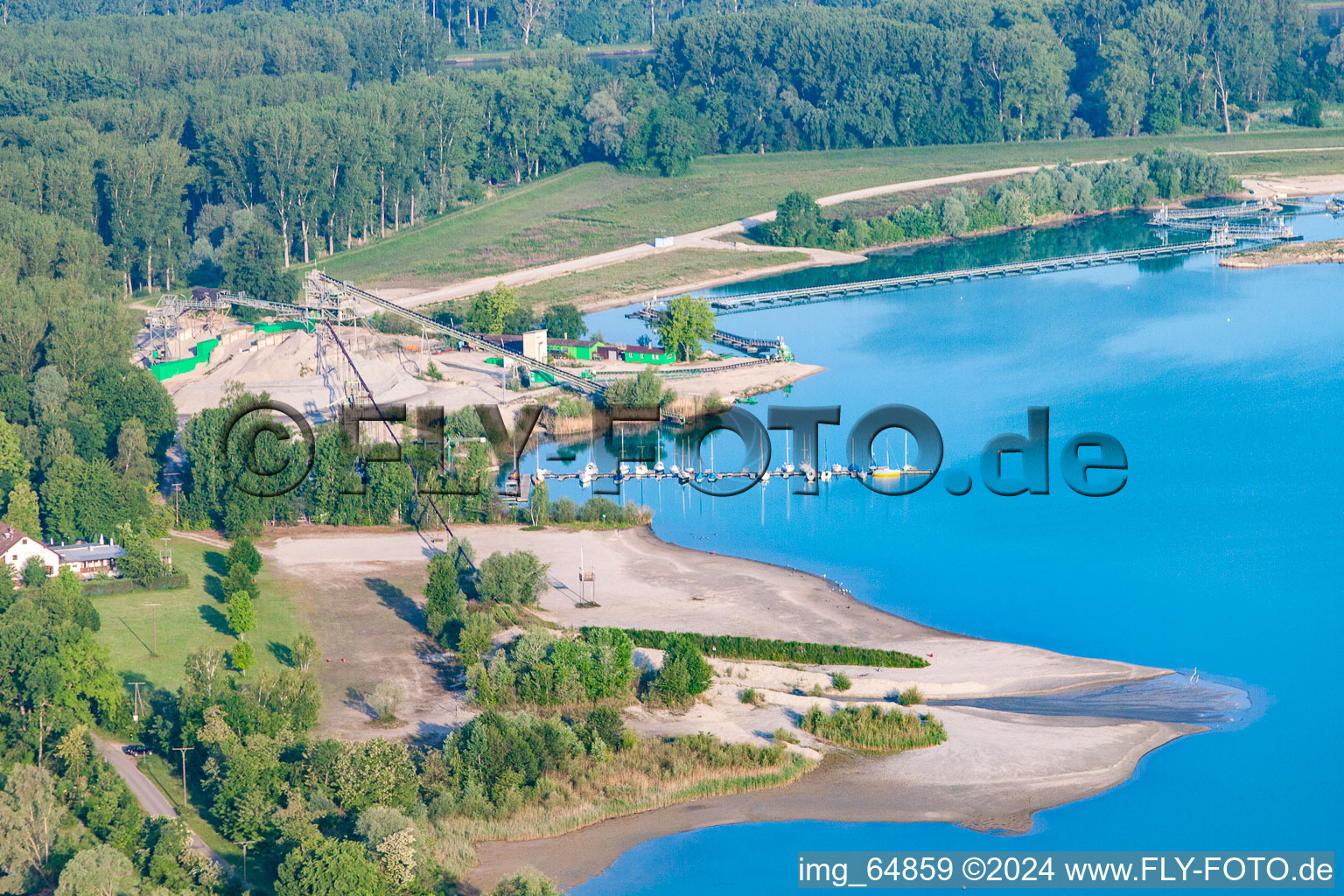 Sailing yachts, beach and Heidelberg Materials Mineralik at the Giessen quarry lake in the district Liedolsheim in Dettenheim in the state Baden-Wuerttemberg, Germany