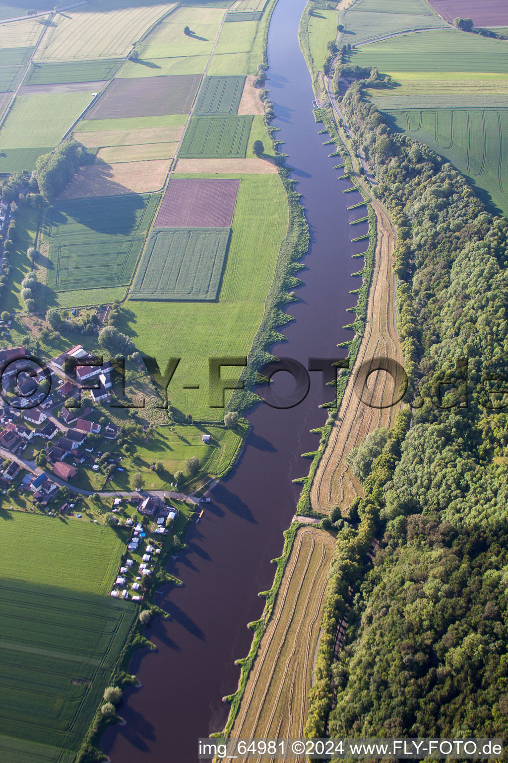 Village on the river bank areas of the Weser river in Brevoerde in the state Lower Saxony, Germany