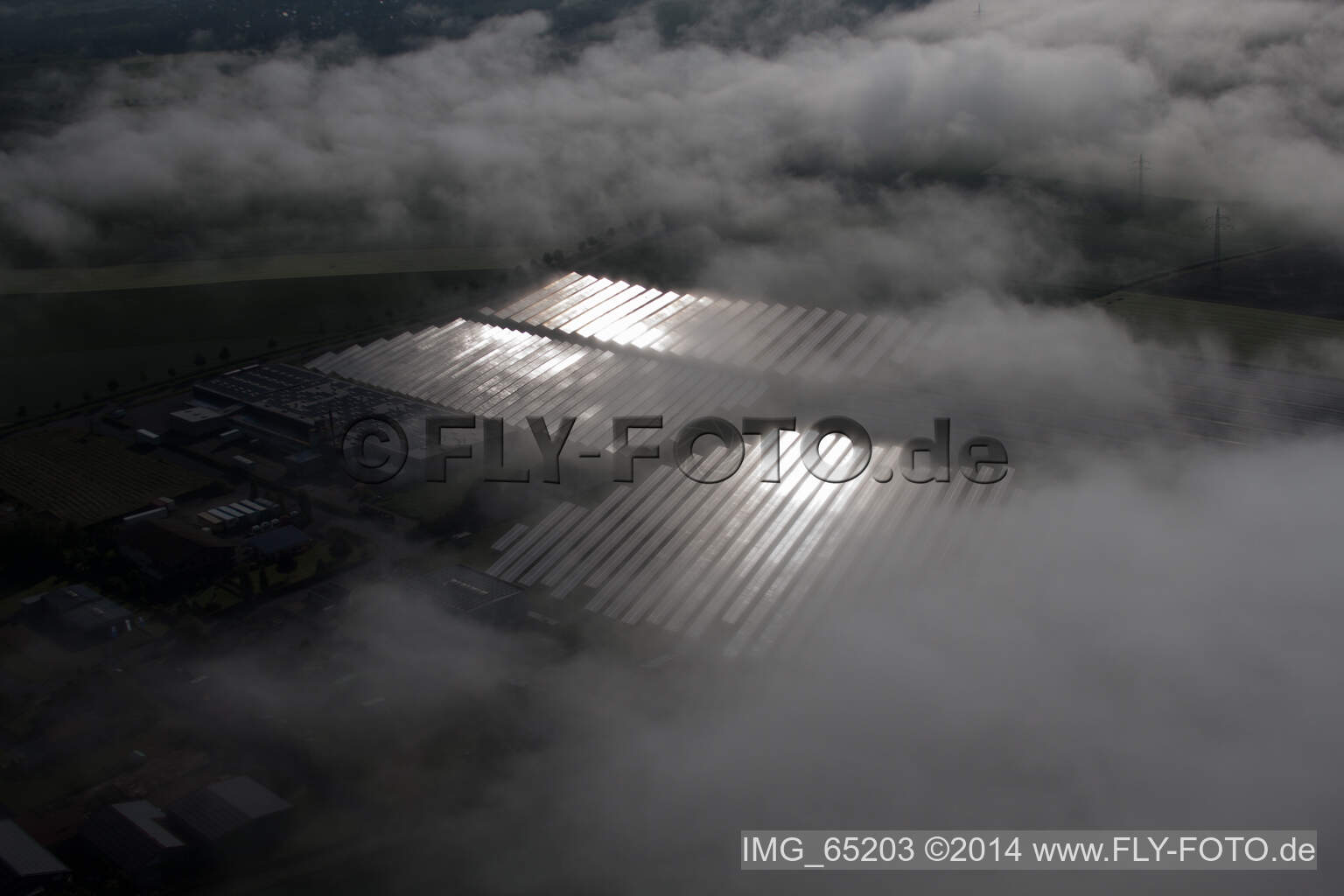 Aerial photograpy of Weather-related panel rows of the photovoltaic plant of the solar park or solar power plant in the district Bredenborn in Marienmuenster in the state North Rhine-Westphalia