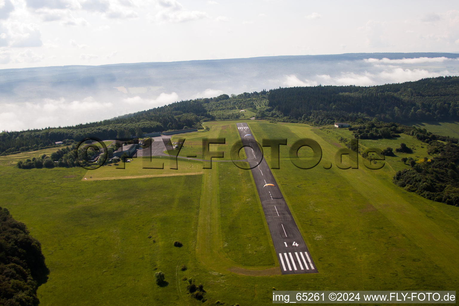 Aerial photograpy of Runway with tarmac terrain of airfield Hoexter-Holzminden with morning mist in the district Brenkhausen in Hoexter in the state North Rhine-Westphalia, Germany