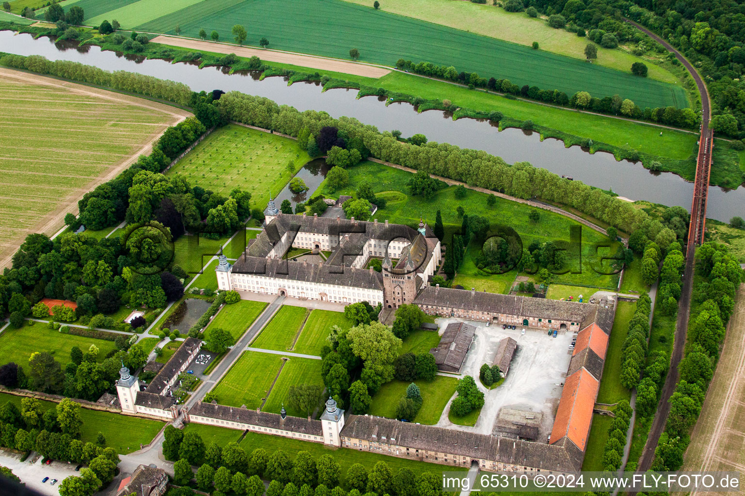 Aerial view of Complex of buildings of the monastery Schloss/Kloster Corvey (UNESCO Weltkulturerbe) in Hoexter in the state North Rhine-Westphalia, Germany