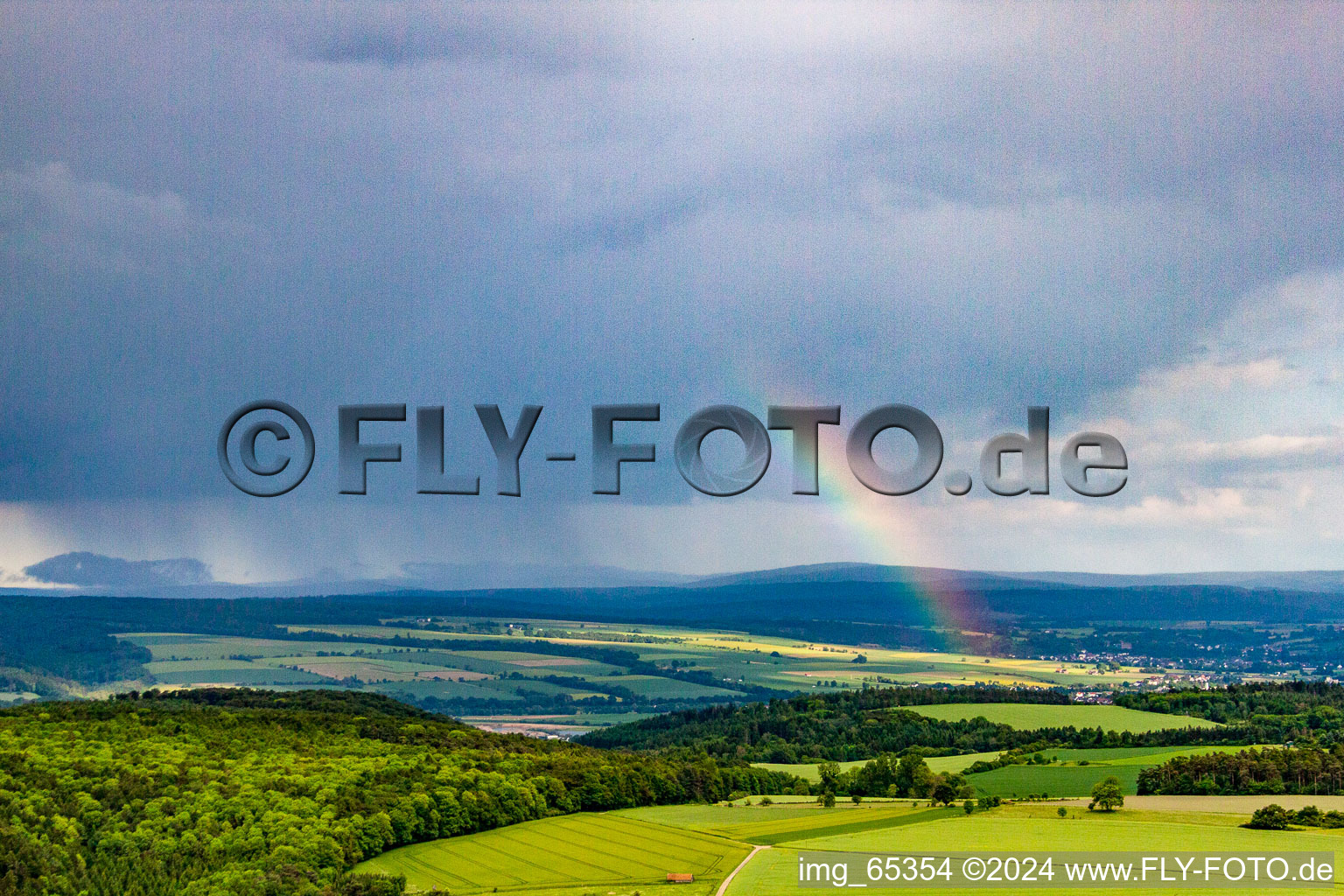 Rainbow over the Kahlenberg in the district Ottbergen in Höxter in the state North Rhine-Westphalia, Germany