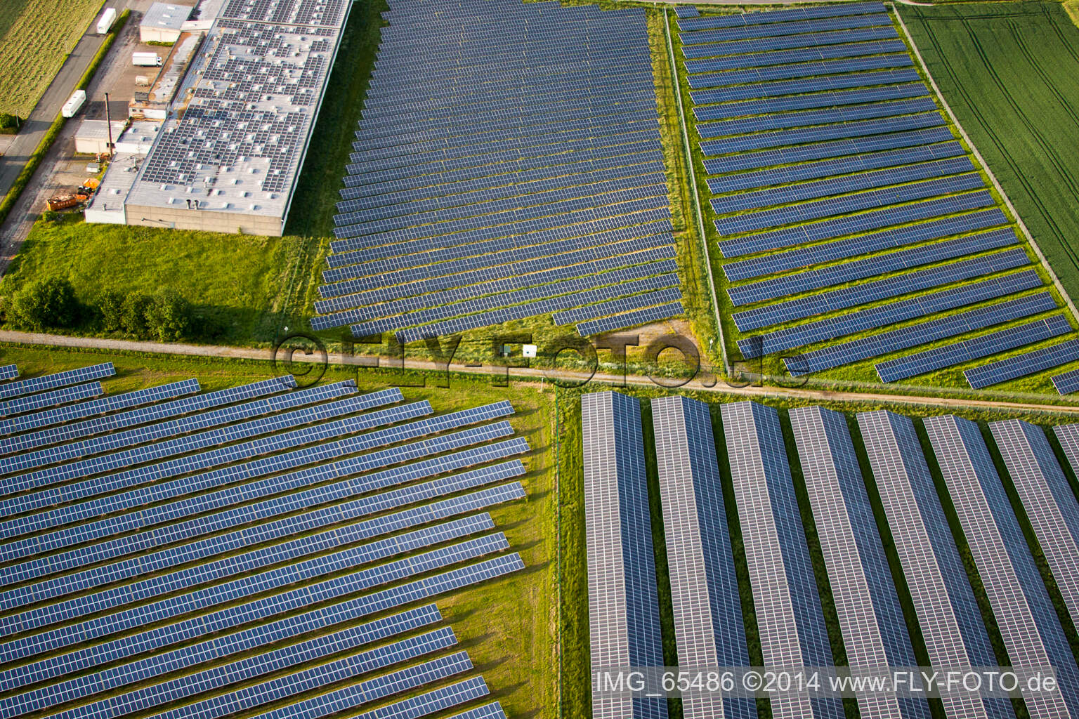 Aerial photograpy of Panel rows of photovoltaic and solar farm or solar power plant in the district Bredenborn in Marienmuenster in the state North Rhine-Westphalia