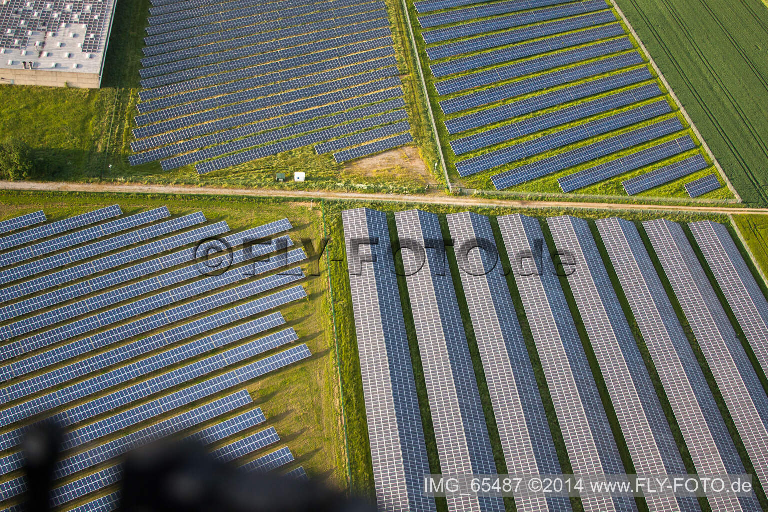Oblique view of Panel rows of photovoltaic and solar farm or solar power plant in the district Bredenborn in Marienmuenster in the state North Rhine-Westphalia