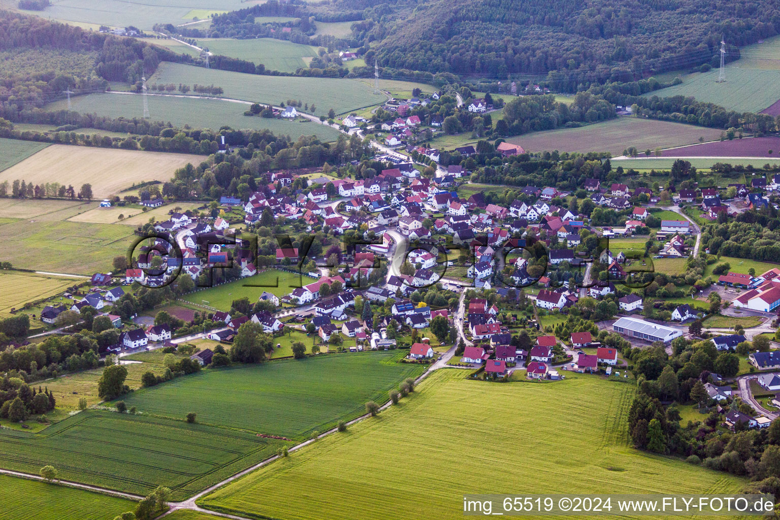 Village - view on the edge of agricultural fields and farmland in the district Rischenau in Luegde in the state North Rhine-Westphalia, Germany