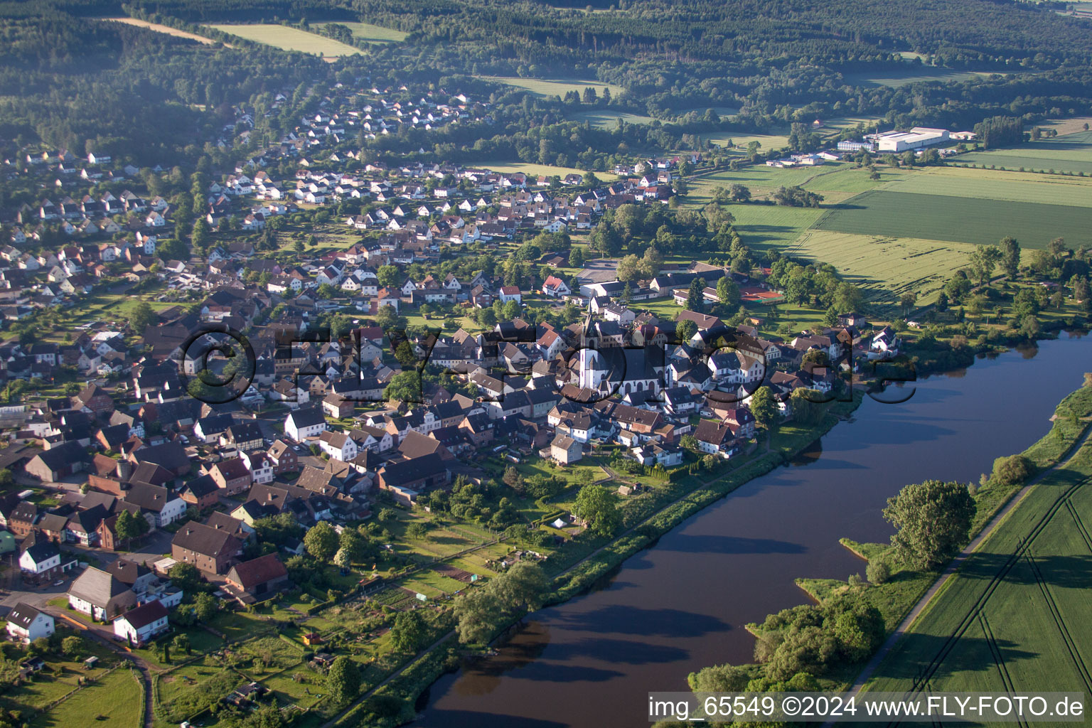 Town on the banks of the river of the Weser river in the district Luechtringen in Hoexter in the state North Rhine-Westphalia, Germany