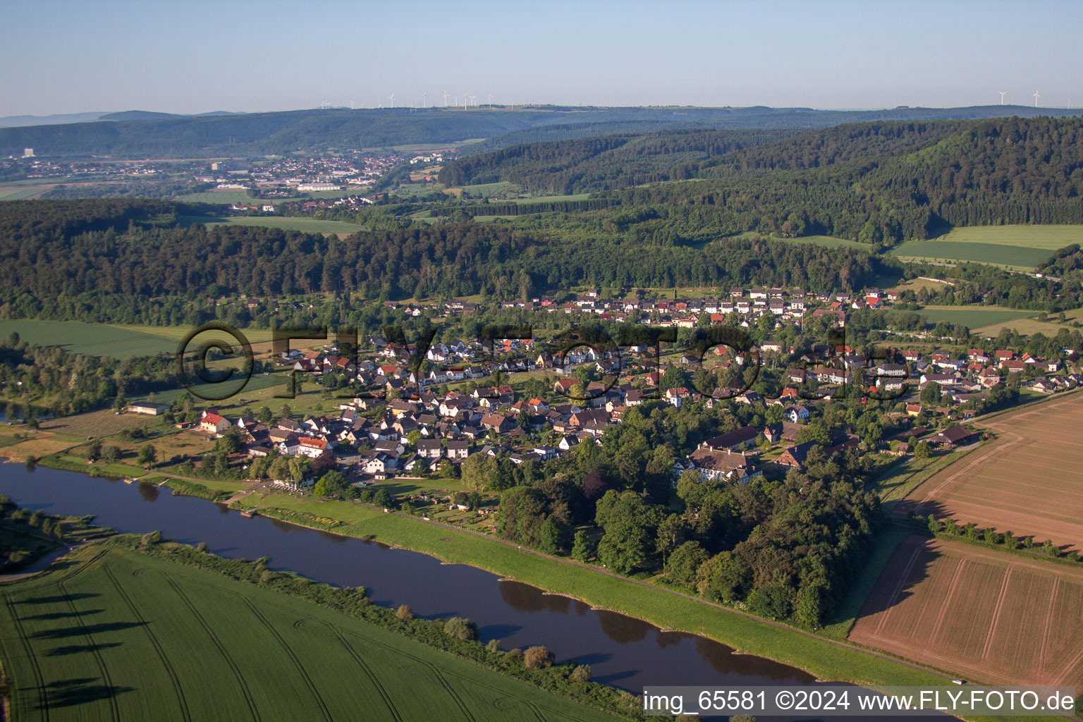 Village on the river bank areas of the Weser river in Wehrden in the state North Rhine-Westphalia, Germany