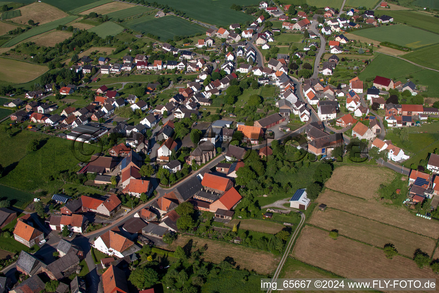 Village - view on the edge of agricultural fields and farmland in the district Haarbrueck in Beverungen in the state North Rhine-Westphalia, Germany