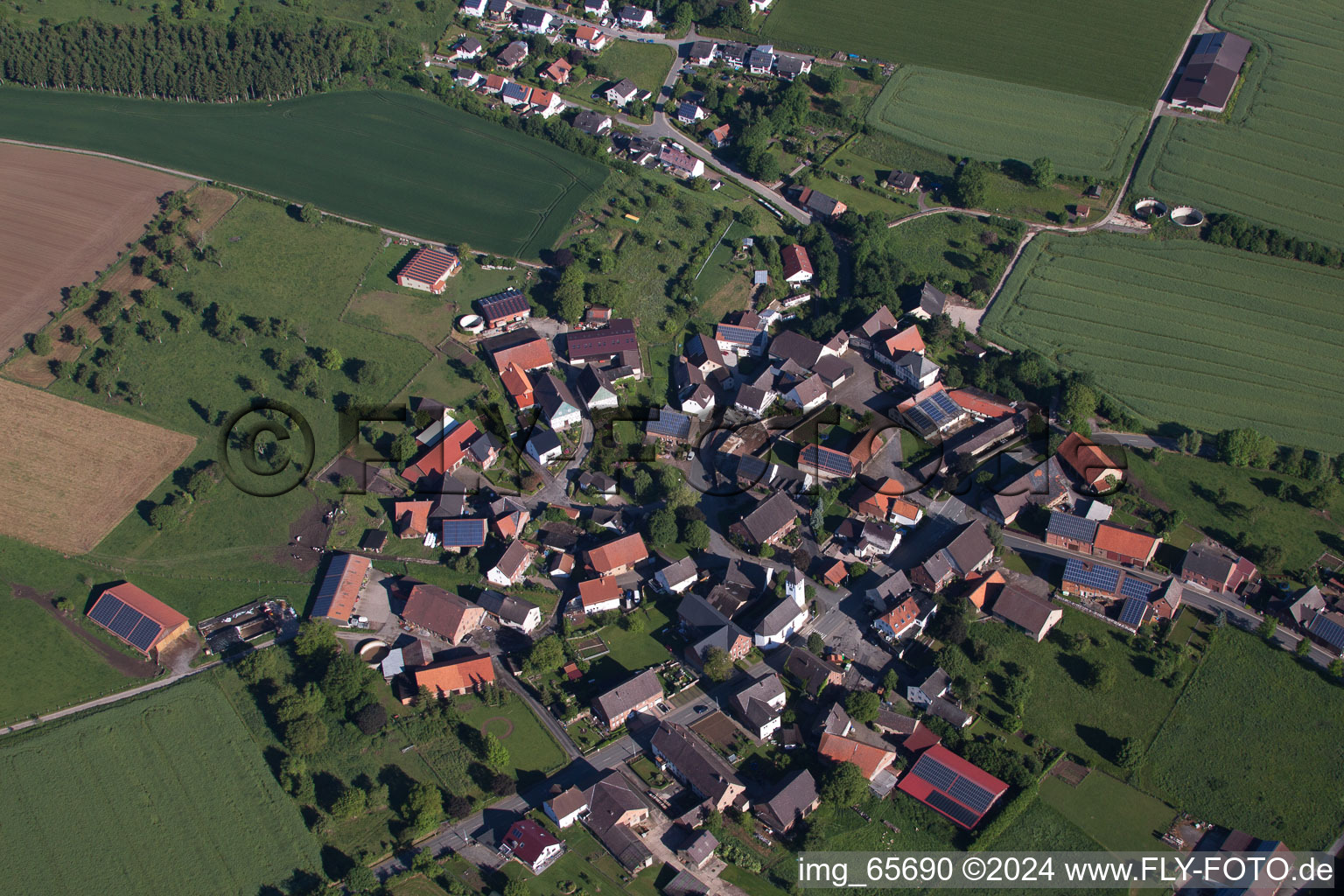 Village - view on the edge of agricultural fields and farmland in the district Drenke in Beverungen in the state North Rhine-Westphalia