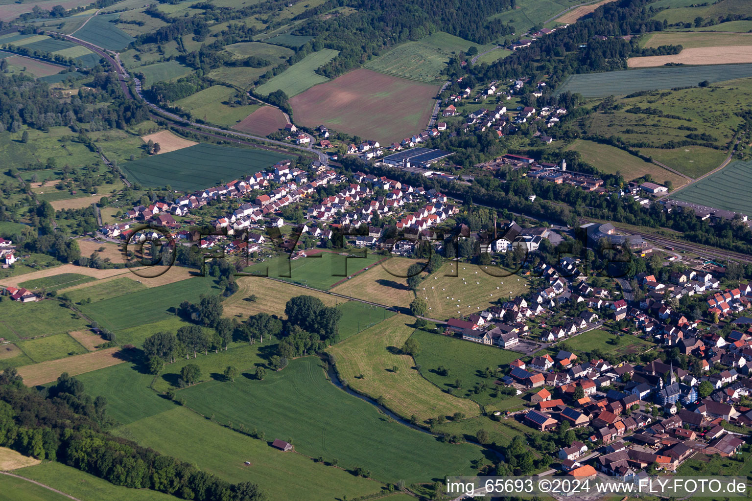 Village - view on the edge of agricultural fields and farmland in the district Ottbergen in Hoexter in the state North Rhine-Westphalia, Germany