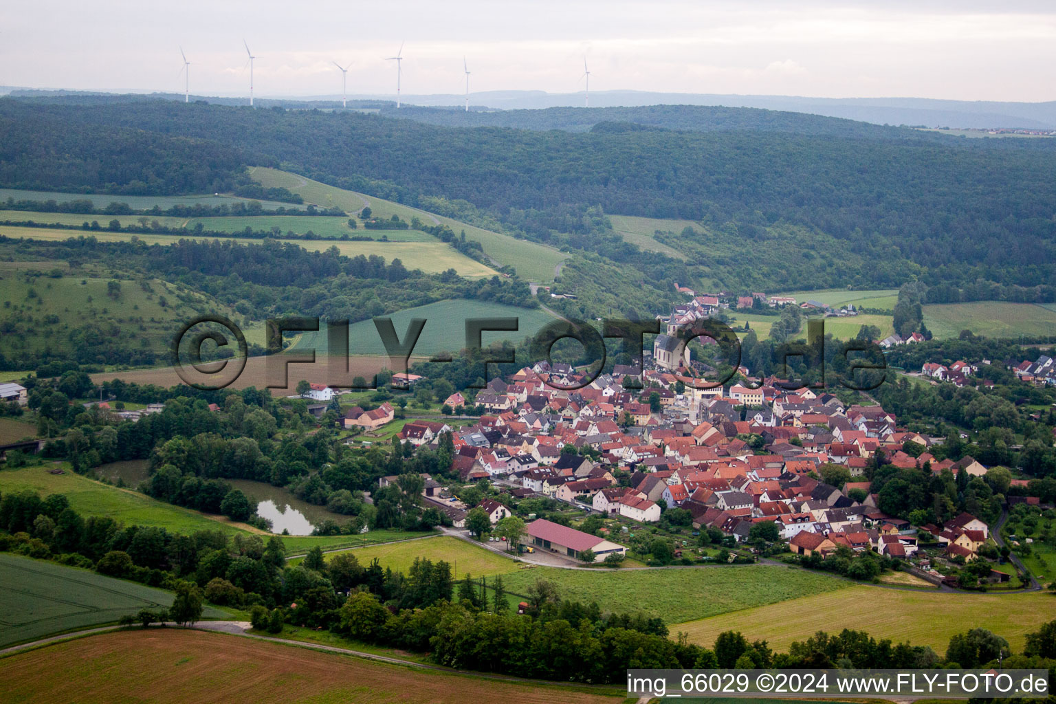 Village - view on the edge of agricultural fields and farmland in Eussenheim in the state Bavaria