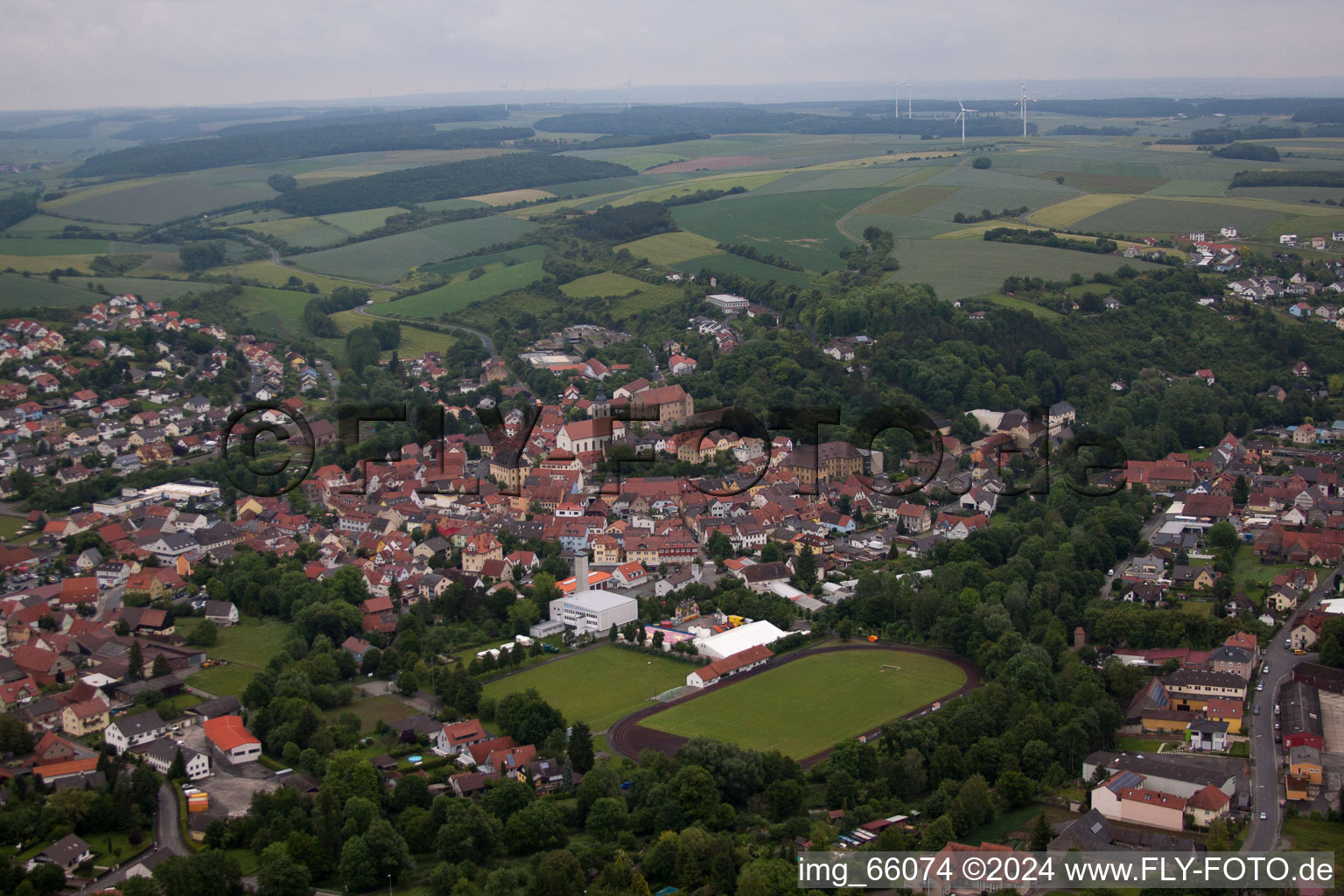 Town View of the streets and houses of the residential areas in Arnstein in the state Bavaria from above