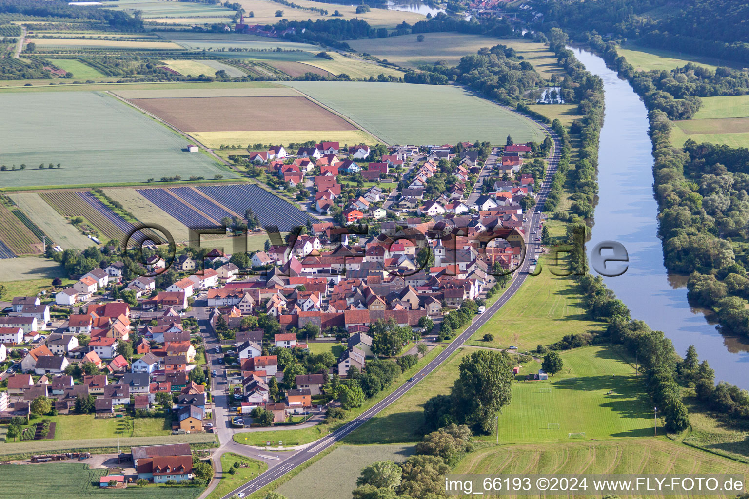 Oblique view of Village on the river bank areas of the Main river in the district Hirschfeld in Roethlein in the state Bavaria, Germany