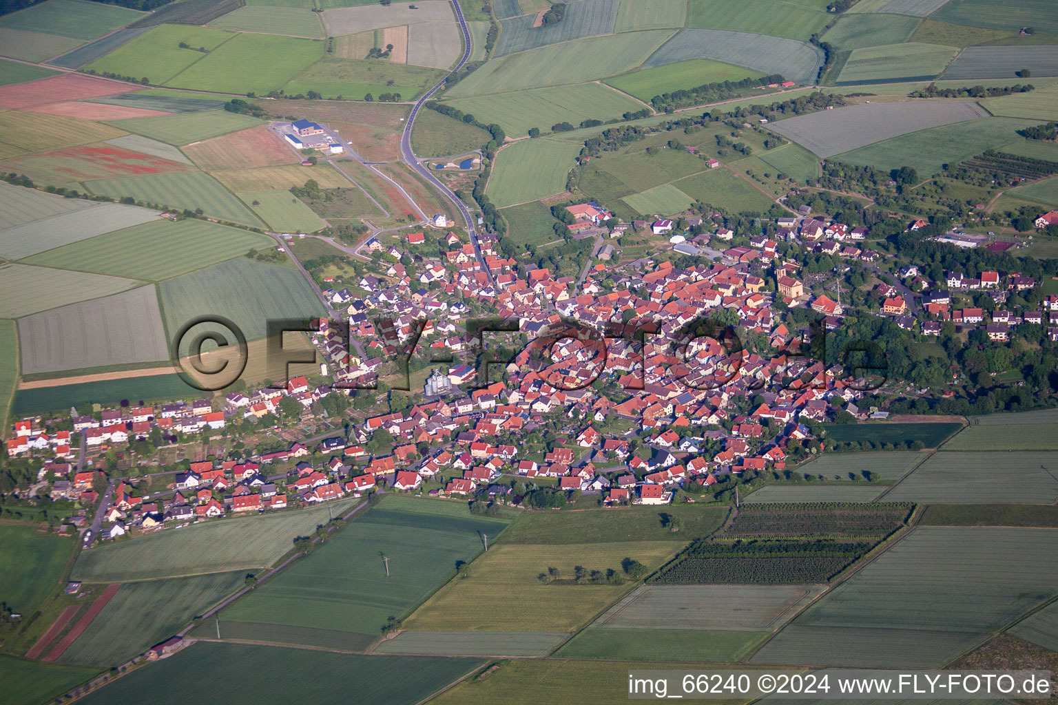 Village - view on the edge of agricultural fields and farmland in Oberaltertheim in the state Bavaria, Germany
