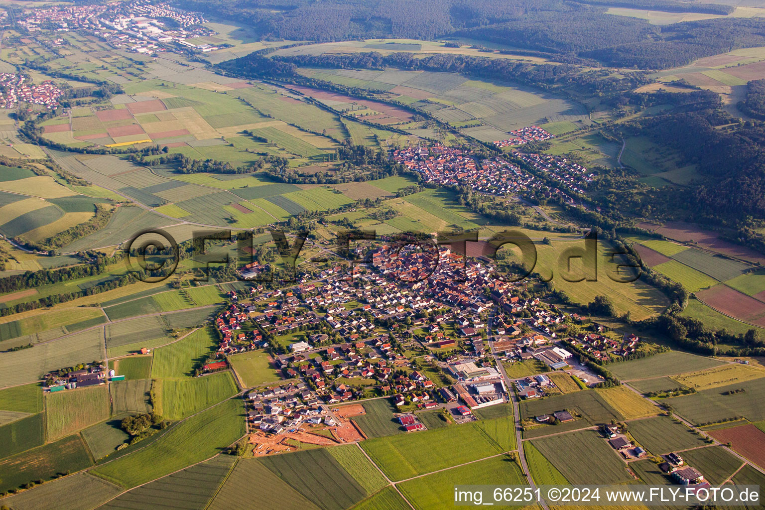 Aerial view of Village - view on the edge of agricultural fields and farmland in Werbach in the state Baden-Wurttemberg, Germany