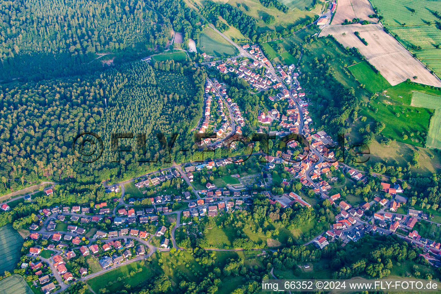 Village - view on the edge of agricultural fields and farmland in Waldwimmersbach in the state Baden-Wurttemberg, Germany