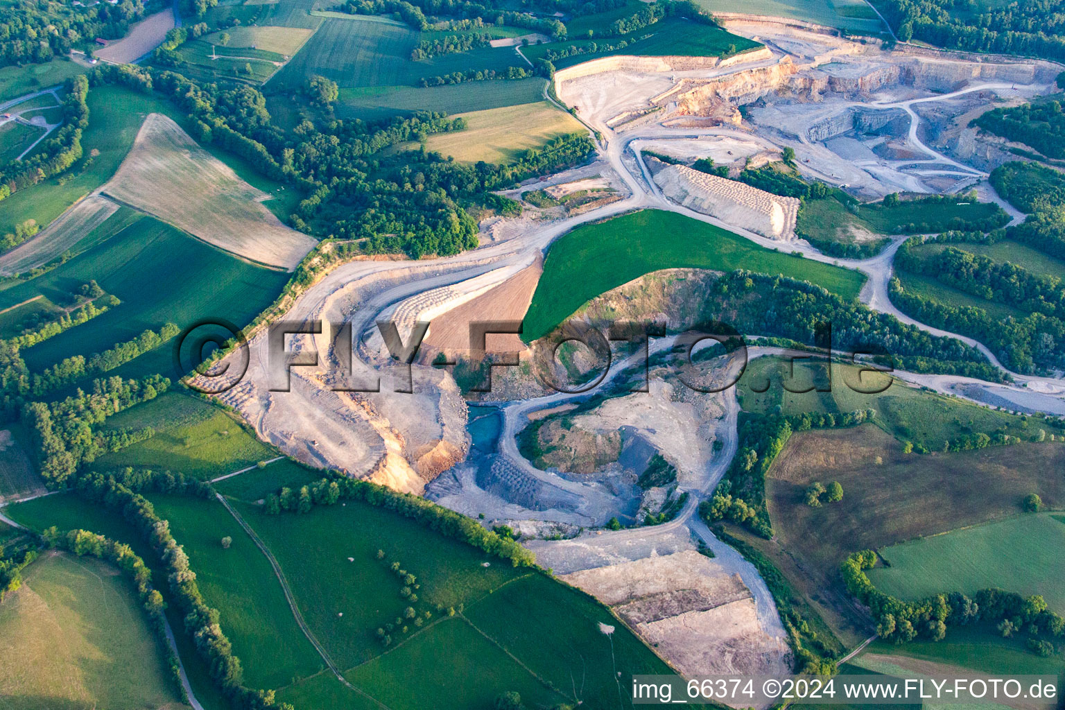 Aerial view of Limestone quarry in the district Maisbach in Nußloch in the state Baden-Wuerttemberg, Germany