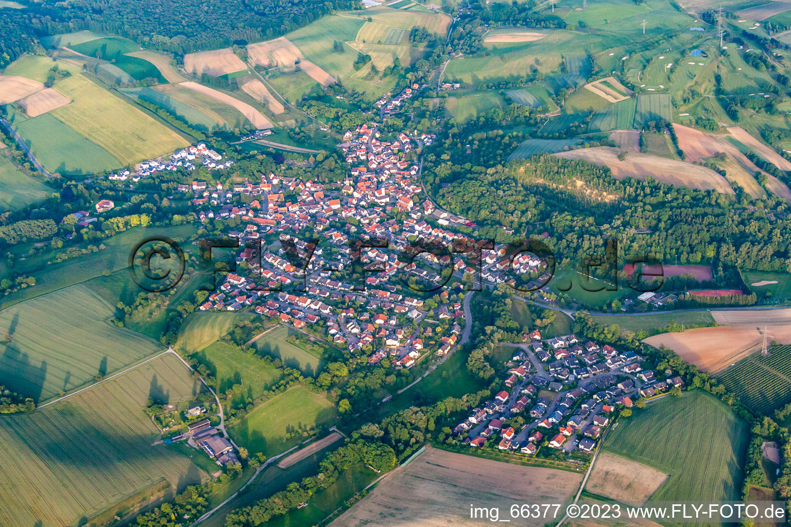 Aerial view of Village - view on the edge of agricultural fields and farmland in Schatthausen in the state Baden-Wurttemberg, Germany