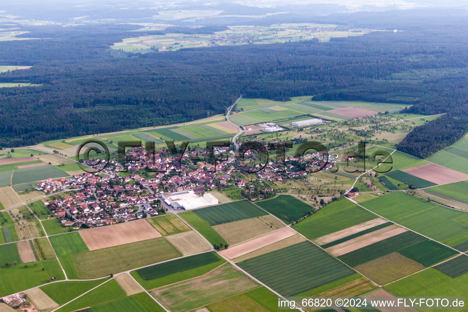 Village - view on the edge of agricultural fields and farmland in the district Oberhaugstett in Neubulach in the state Baden-Wurttemberg, Germany