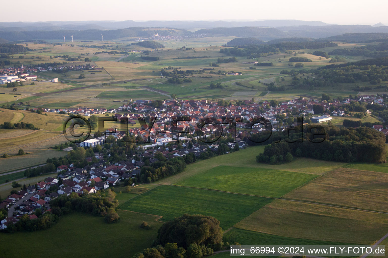 Village - view on the edge of agricultural fields and farmland in the district Genkingen in Sonnenbuehl in the state Baden-Wurttemberg, Germany