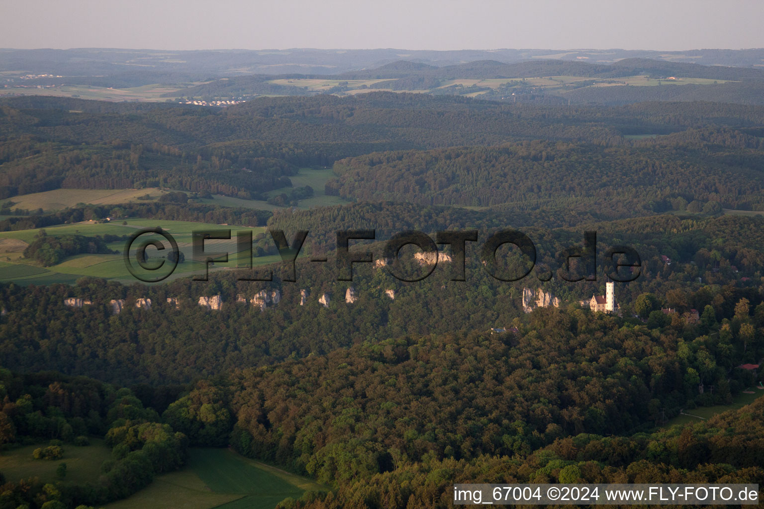 Wood and mountain landscape Albtrauf in the Swabian nightmare with the castle Bright stone in the district Unterhausen in Lichtenstein in the federal state Baden-Wurttemberg